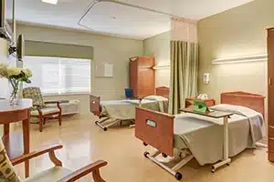 Resident room with beds and furnishings at Kettering Heights Post Acute facility in Kettering, OH